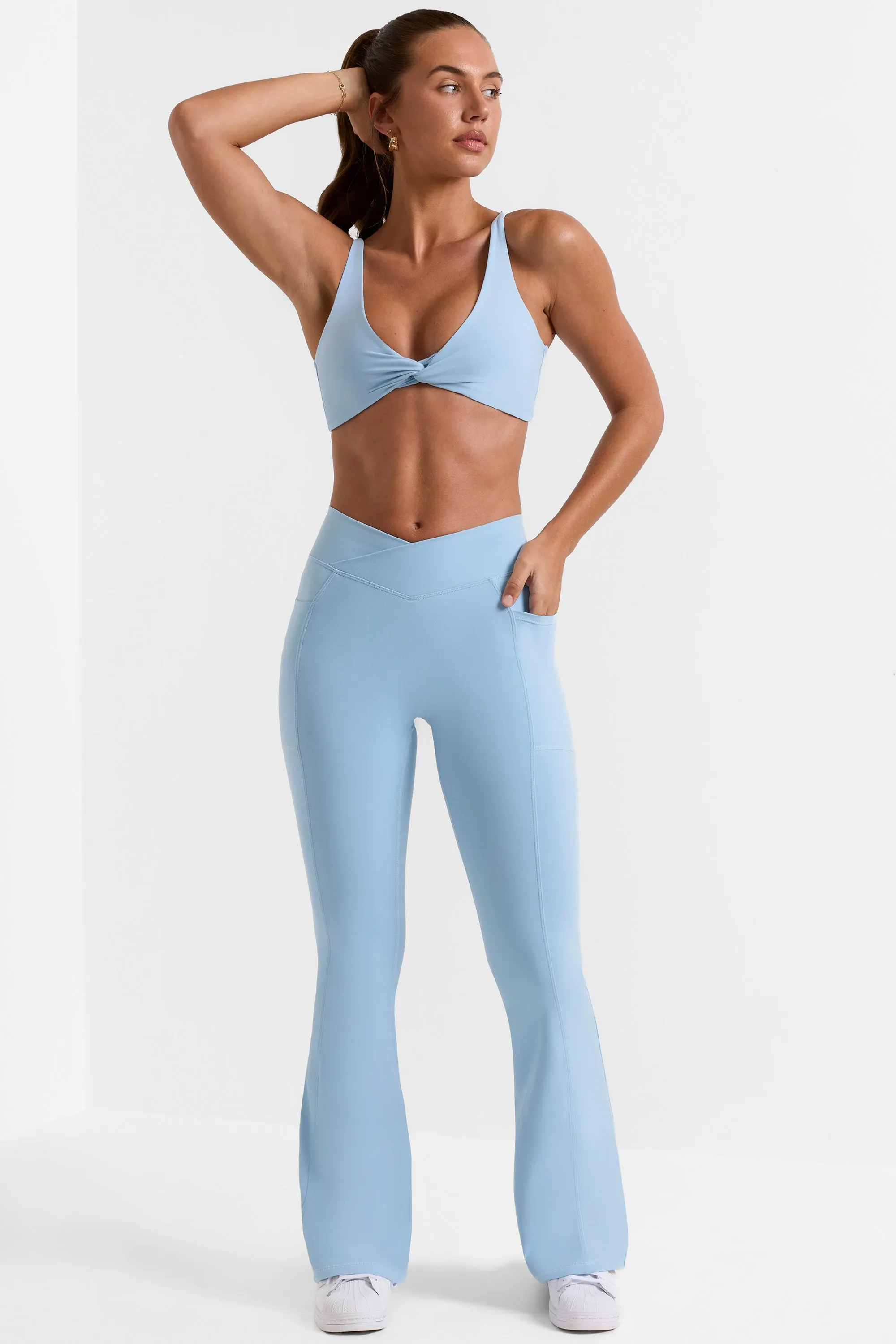 Cross Waistband Flare Pocket Leggings in Ice Blue